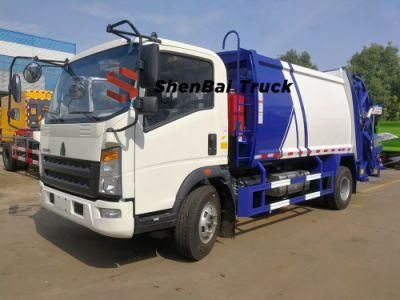 Hot Sale HOWO 4X2 Left Hand Drive 6cbm Hydraulic Compression Garbage Truck