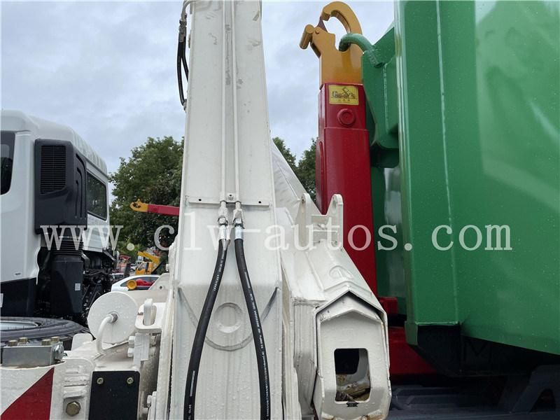 Sinotruk HOWO 8X4 LHD Hydraulic Hooklift Garbage Truck with 18-20cbm Garbage Container with 5 Tons Folded Arm Crane