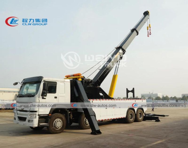 Sinotruk HOWO 8X4 420HP Right Hand Drive Rhd Rotation 50tons Road Recovery Wrecker Tow Truck with Two 25tons Winches