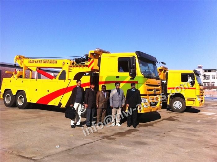 Sinotruk HOWO 8X4 420HP Right Hand Drive Rhd Rotation 50tons Road Recovery Wrecker Tow Truck with Two 25tons Winches